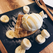 Classic combo waffle with banana, vanilla ice cream and honey sauce