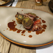 Mint crusted lamb chops served with chard pudding and pine nuts