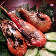 Grilled giant prawns with a tangy green dipping sauce (spicy!)