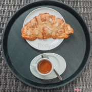 Almond croissant with espresso